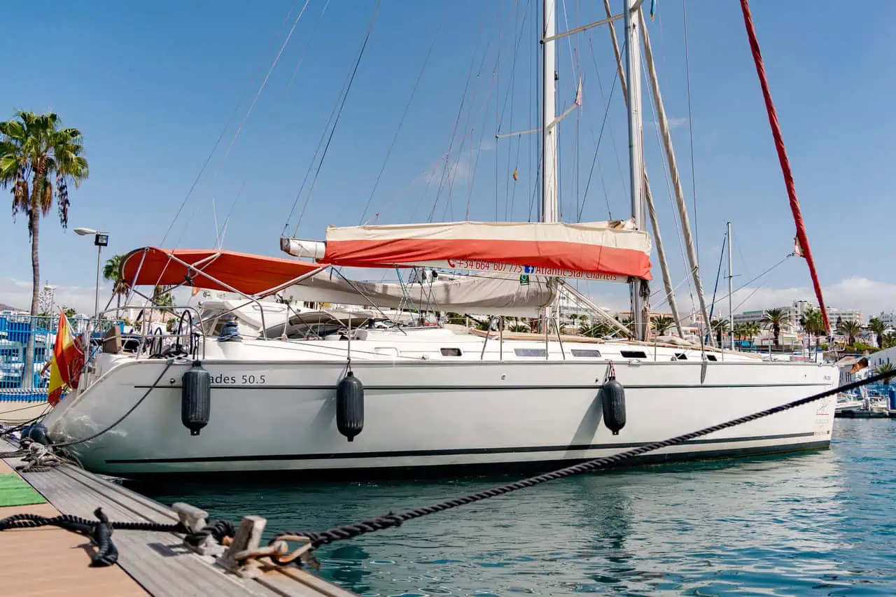 Sailing yacht docked in Puerto Colón ready for private charters in Tenerife.