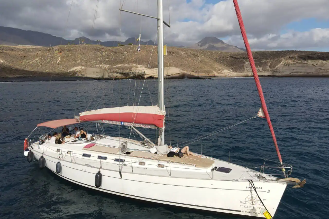 Atlantic Star sailing yacht anchored near the Costa Adeje coast during a small group whale watching tour in Tenerife